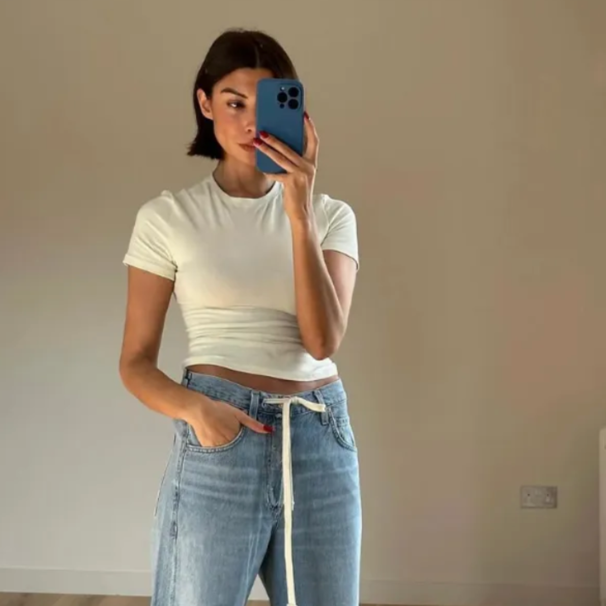 Marianne Smyth wears the draw string denim jean trend.