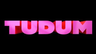 Captura de pantalla del logotipo de Netflix Tudum 2023 escrito en rosa sobre fondo negro