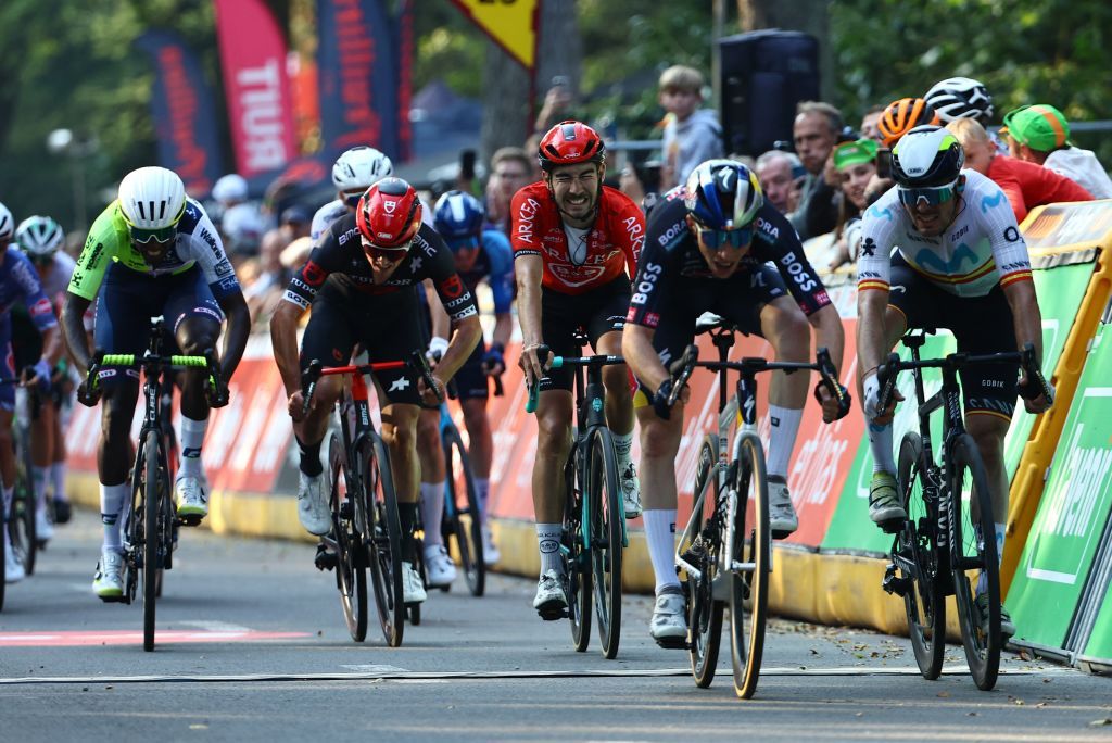 Spanish Roger Adria of Red Bull-Bora-Hansgrohe (2R) celebrates as he crosses the finish line to win the one day cycling race Grand Prix de Wallonie 2024 (202,3 km), from Blegny to the Citadelle de Namur, in Namur, on Wednesday 18 September 2024.
BELGA PHOTO DAVID PINTENS (Photo by DAVID PINTENS / BELGA MAG / Belga via AFP)