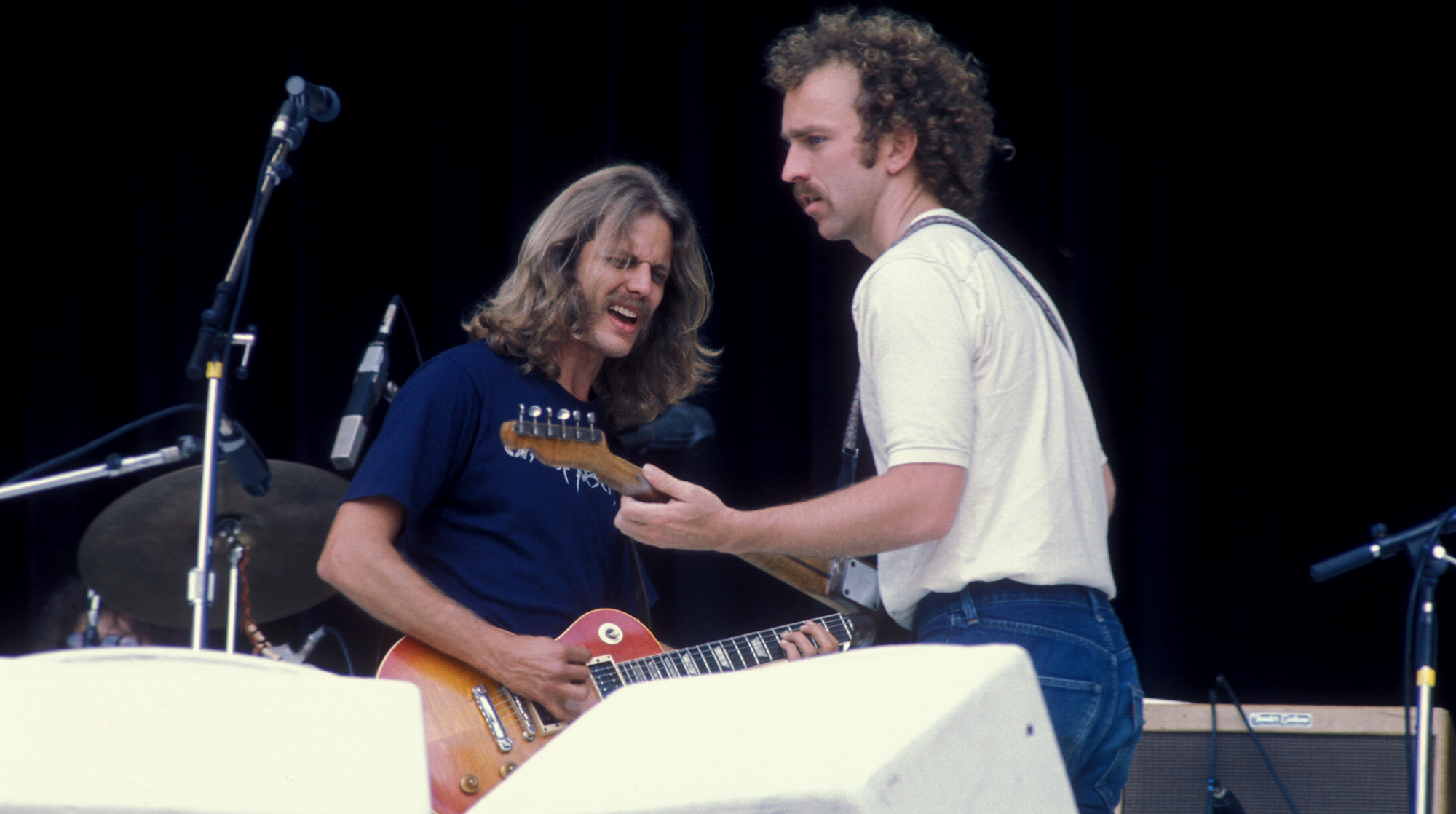 US band the Eagles perform at Wembley Stadium &#039;Mid Summer Festival&#039; in London, UK, 21st June 1975. L-R Don Felder and Bernie Leadon