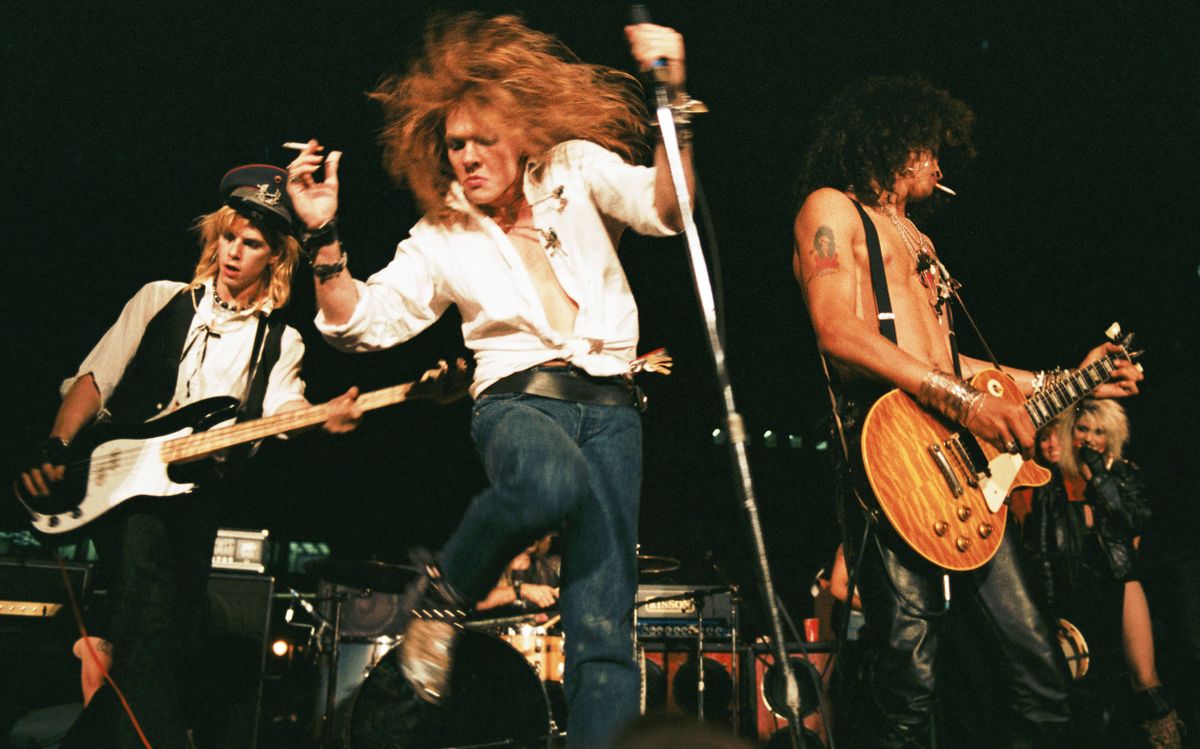 Duff McKagan, Axl Rose and Slash of the rock group &#039;Guns n&#039; Roses&#039; perform at the LA Street Scene on September 28, 1985 in Los Angeles, California. Slash uses a Gibson Les Paul electric guitar for the first time onstage with the band. (