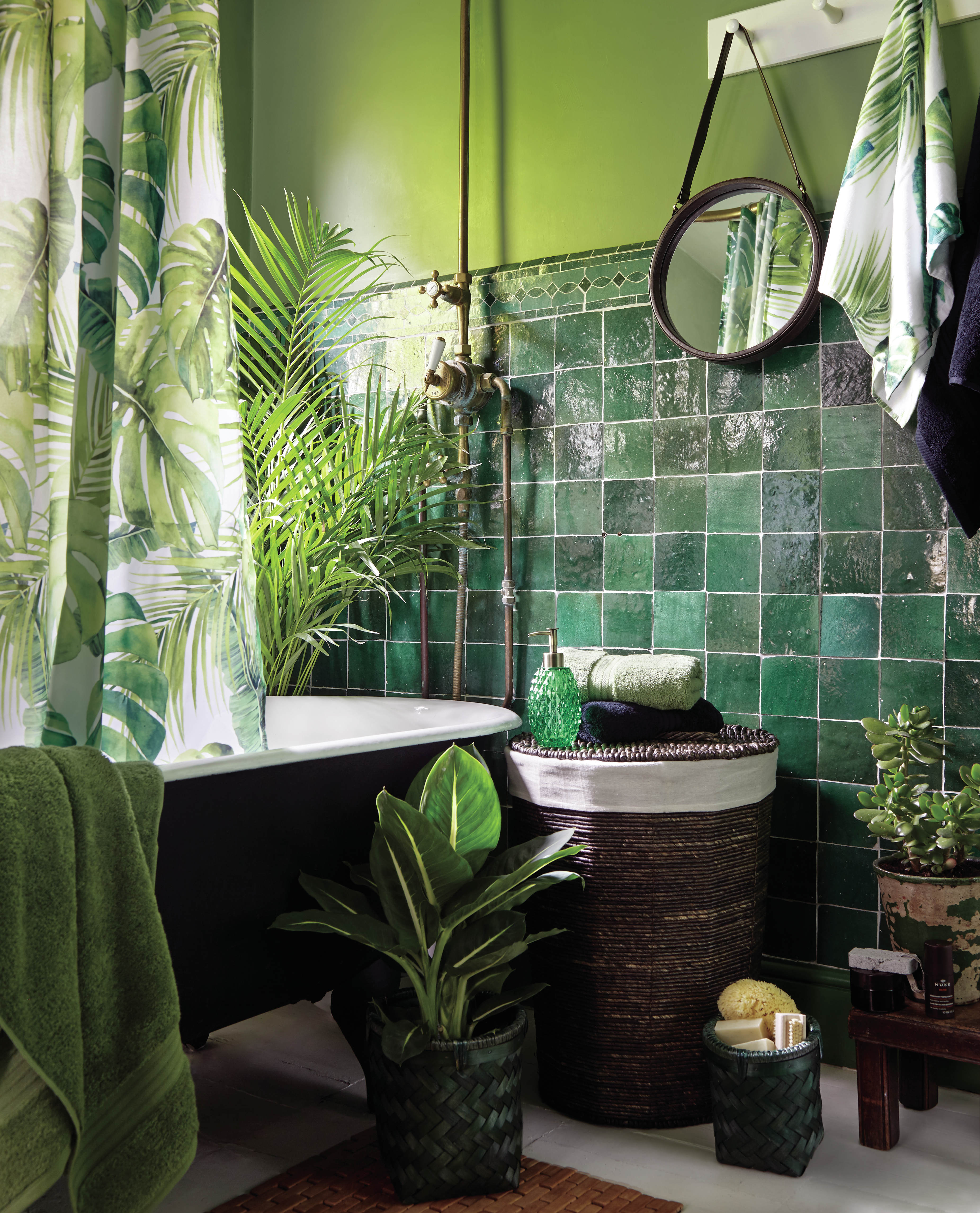 Green bathroom with small bathroom storage baskets