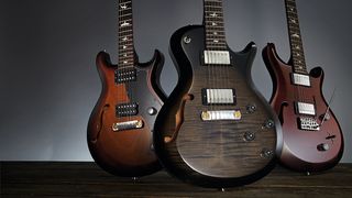 A collection of PRS electric guitars