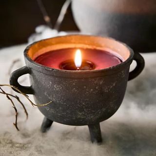 A witch's cauldron-shaped candle from Anthropologie