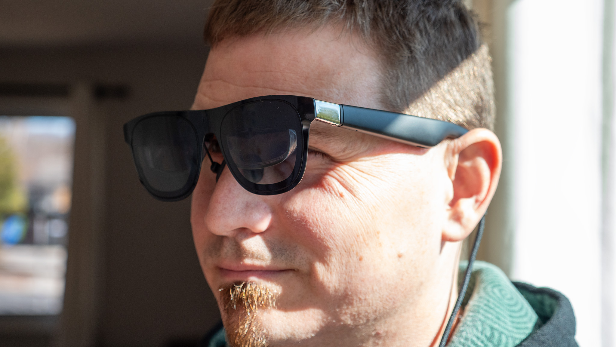 Wearing a pair of Xreal One smart glasses to show off the fit and size