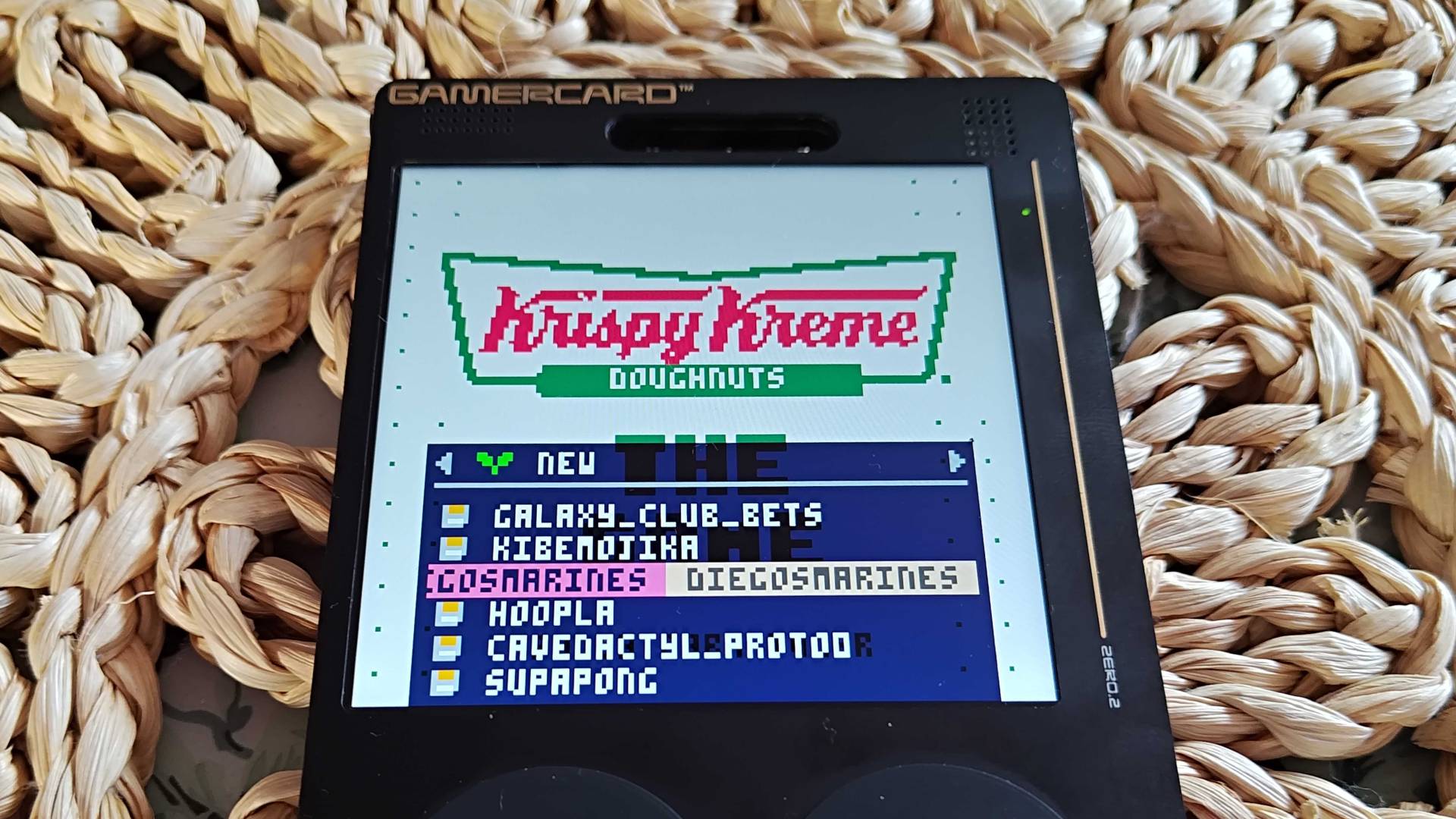 Close up of Gamercard with PICO-8 app open and Krispy Kreme game selected.