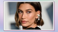 Hailey Rhode Bieber wearing a black dress and silver earrings as she attends the 2023 Vanity Fair Oscar Party Hosted By Radhika Jones at Wallis Annenberg Center for the Performing Arts on March 12, 2023 in Beverly Hills, California/ in pink, green and blue pastel template
