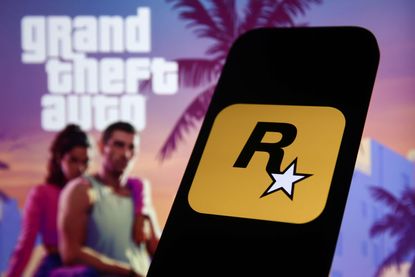 GTA 6 trailer image on website displayed on a laptop screen and Rockstar Games logo