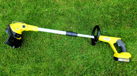 Karcher LTR 18 30 grass strimmer laid on lawnrtimmer