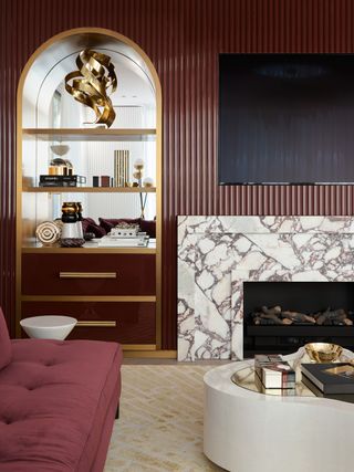 living room with red lacquered walls and gold accents