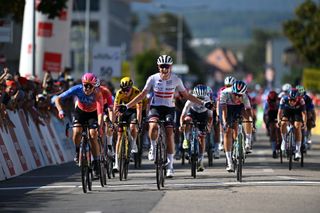 Sofia Bertizzolo (L) passes Carina Schrempf at the line on stage 1 of Tour de Romandie