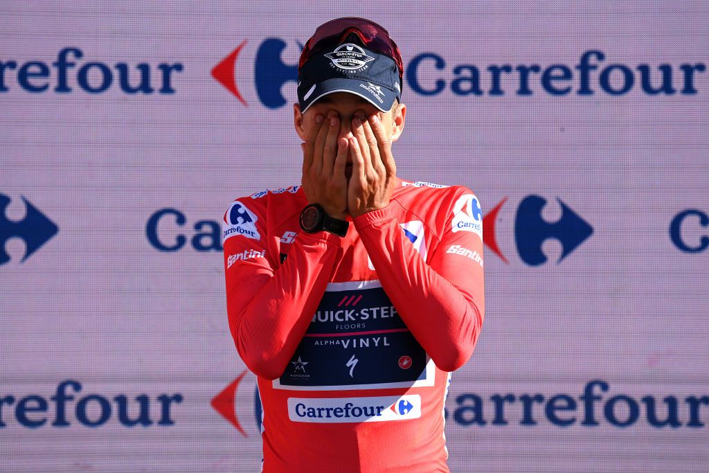 NAVACERRADA SPAIN SEPTEMBER 10 Remco Evenepoel of Belgium and Team QuickStep Alpha Vinyl Red Leader Jersey celebrates at podium during the 77th Tour of Spain 2022 Stage 20 a 181km stage from Moralzarzal to Puerto de Navacerrada 1851m LaVuelta22 WorldTour on September 10 2022 in Puerto de Navacerrada Spain Photo by Justin SetterfieldGetty Images