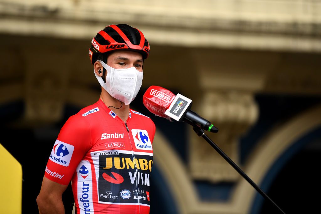 ALTODELANGLIRU SPAIN NOVEMBER 01 Start Primoz Roglic of Slovenia and Team Jumbo Visma Red Leader Jersey Mask Covid safety measures Team Presentation during the 75th Tour of Spain 2020 Stage 12 a 1094km stage from Pola de Laviana to Alto de lAngliru 1560m lavuelta LaVuelta20 La Vuelta on November 01 2020 in Alto de lAngliru Spain Photo by David RamosGetty Images