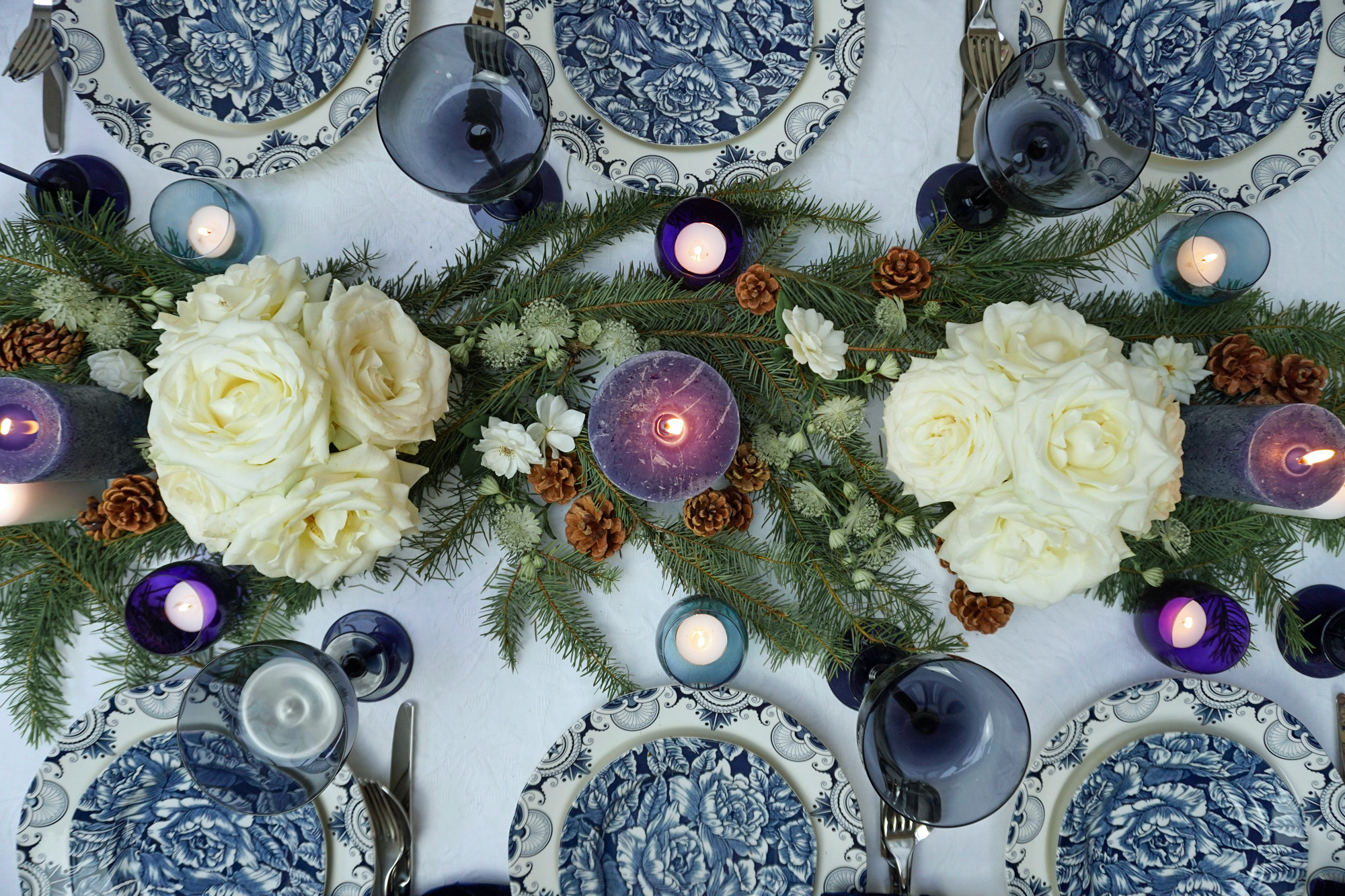 Christmas table with crockery and flowers