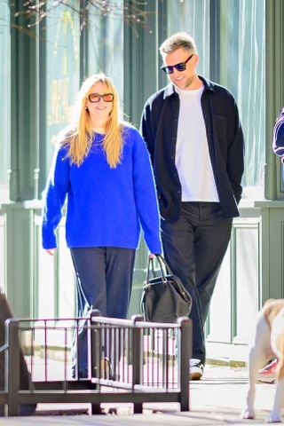 Jennifer Lawrence wears a cobalt blue jumper.