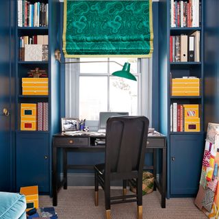 Blue home office with green curtains
