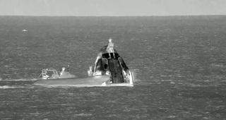 A recovery team member mounts the Dragon Polaris Dawn Capsule capsule