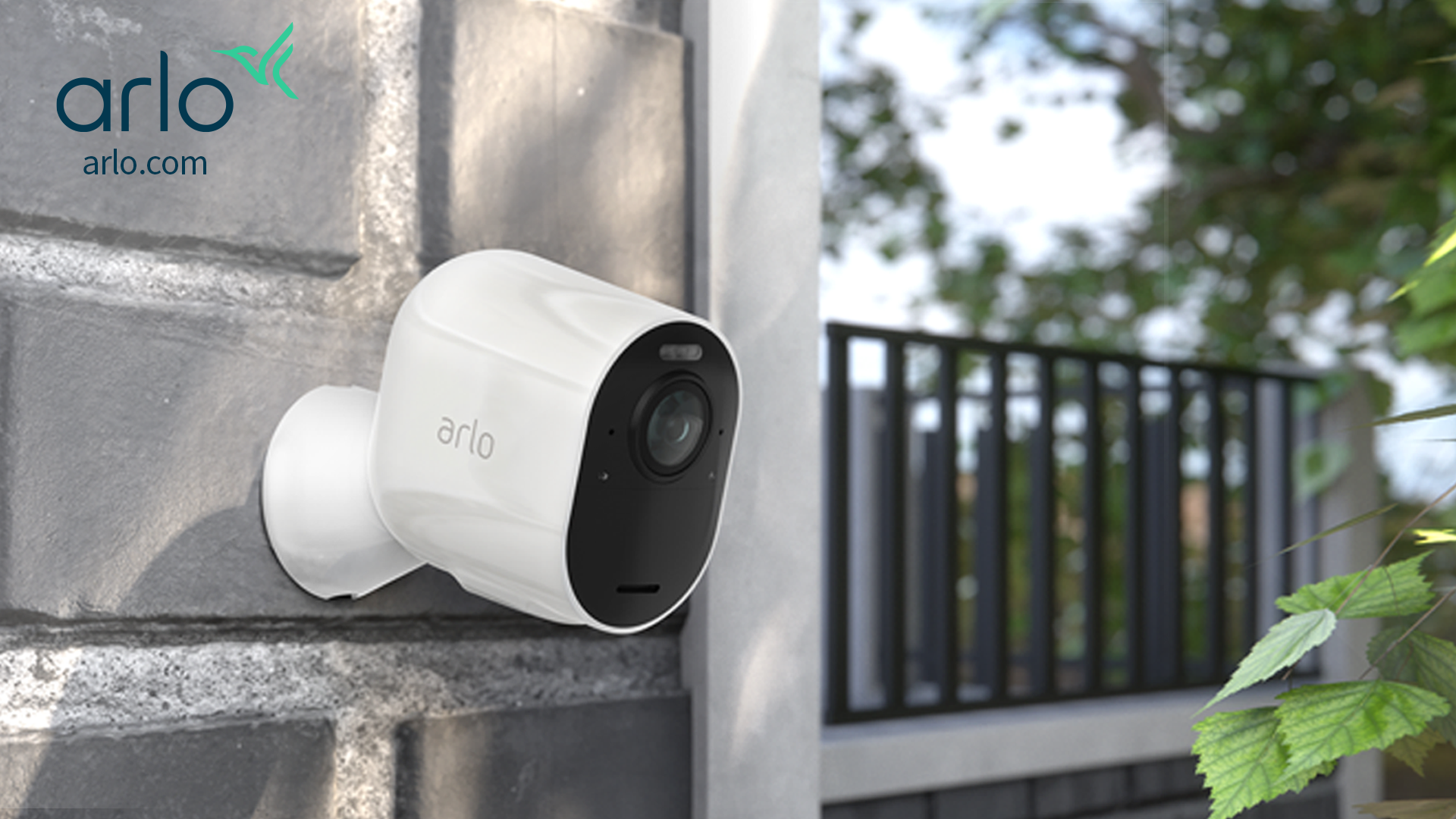 Arlo Ultra 2 camera mounted on a brick wall in a property
