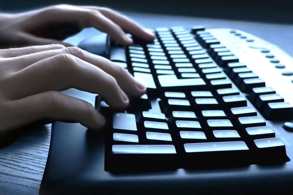 Hany typing on computer keyboard