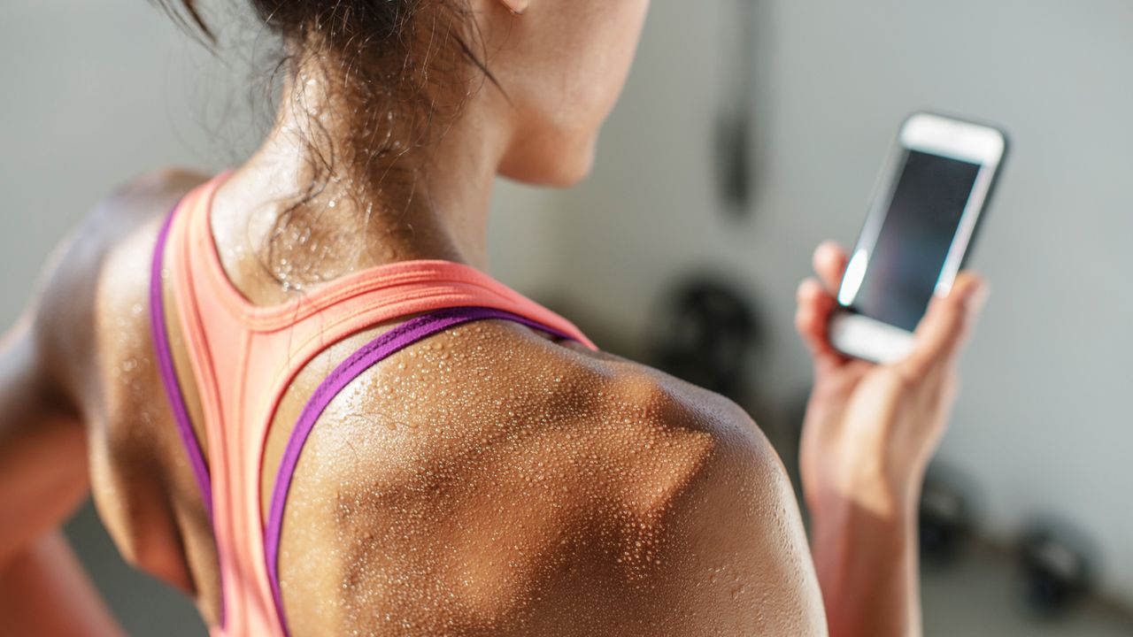 Woman sweats wearing workout wear