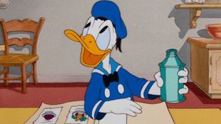 Donald Duck tries to cook dinner in his kitchen