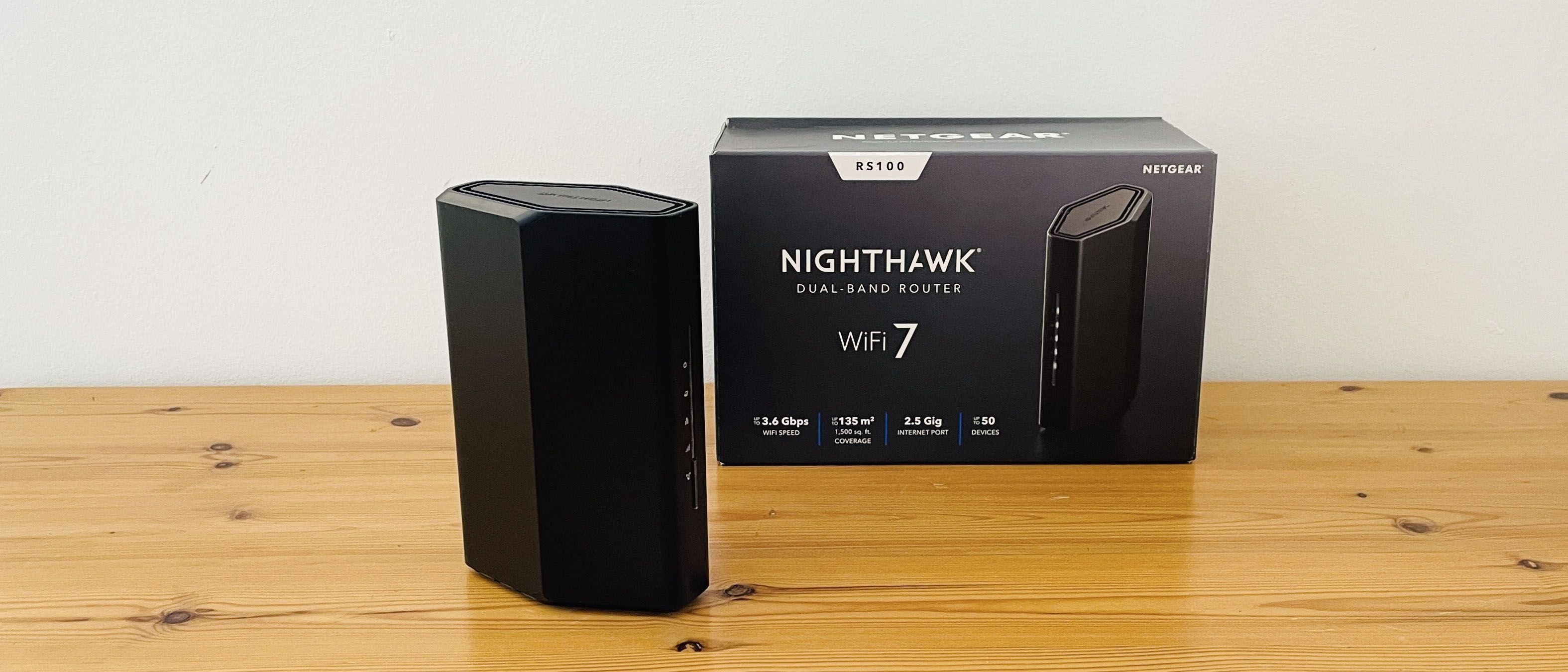 Netgear Nighthawk RS100 router on wooden table