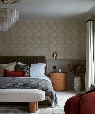 bedrooom with pale patterned wallpaper