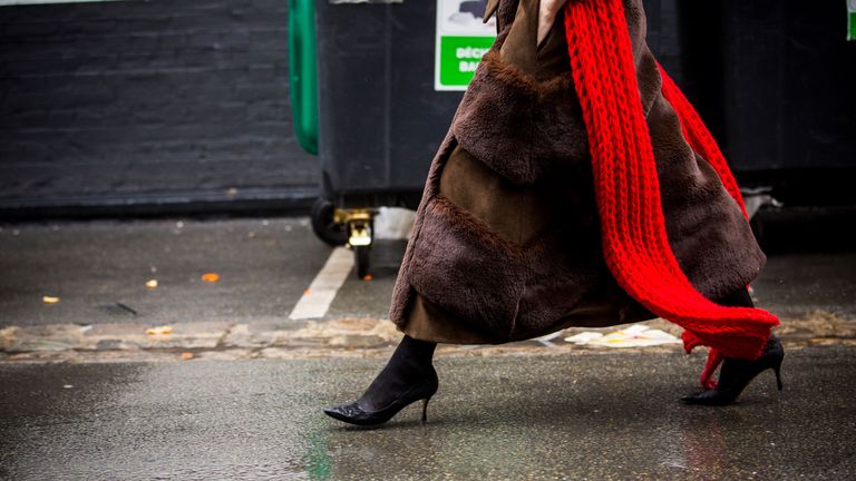 paris, france march 04 fashion detail of anya ziourova outfit, brown fur coat and red oversized scarf, is seen in the streets of paris after the balenciaga show during paris fashion week womenswear fallwinter 20182019 on march 4, 2018 in paris, france photo by claudio laveniagetty images