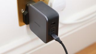 Ugreen Nexode 140W charger in a wall socket