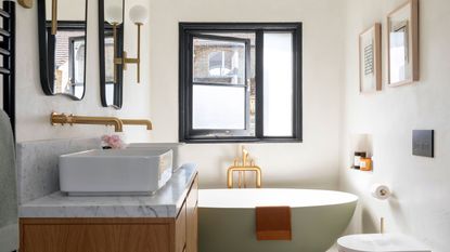 White bathroom with venetian blinds