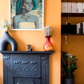 orange living room with black fireplace