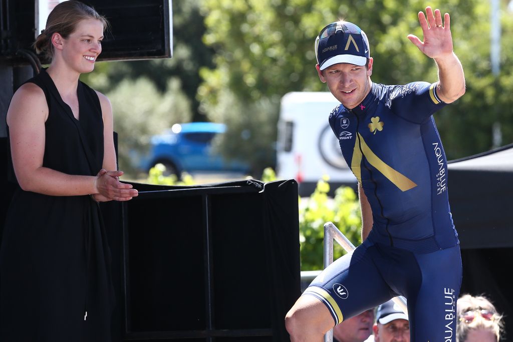 Aaron Gate (Aqua Blue Sports) walks onto the podium