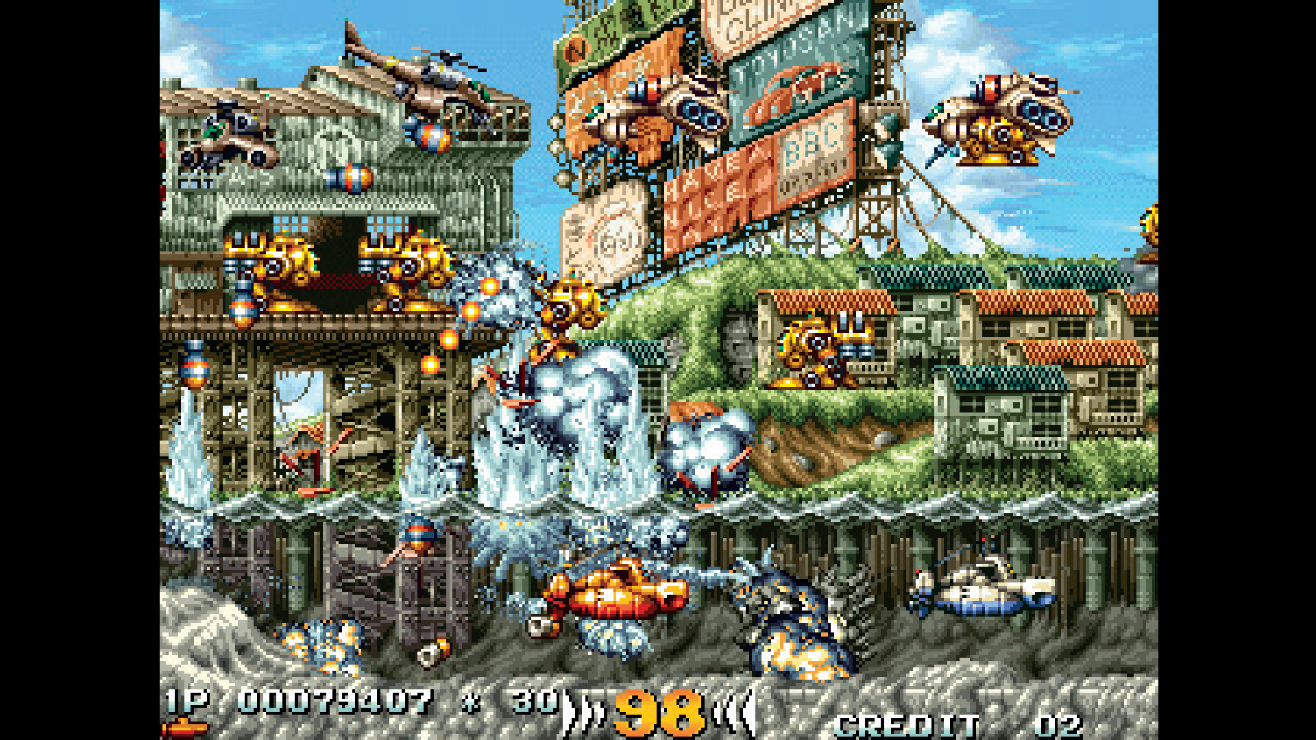 Chaotic vehicle combat across lush blue water in Metal Slug, from Retro Gamer #98