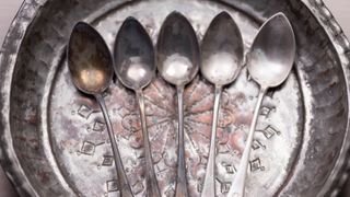 Tarnished silver spoons