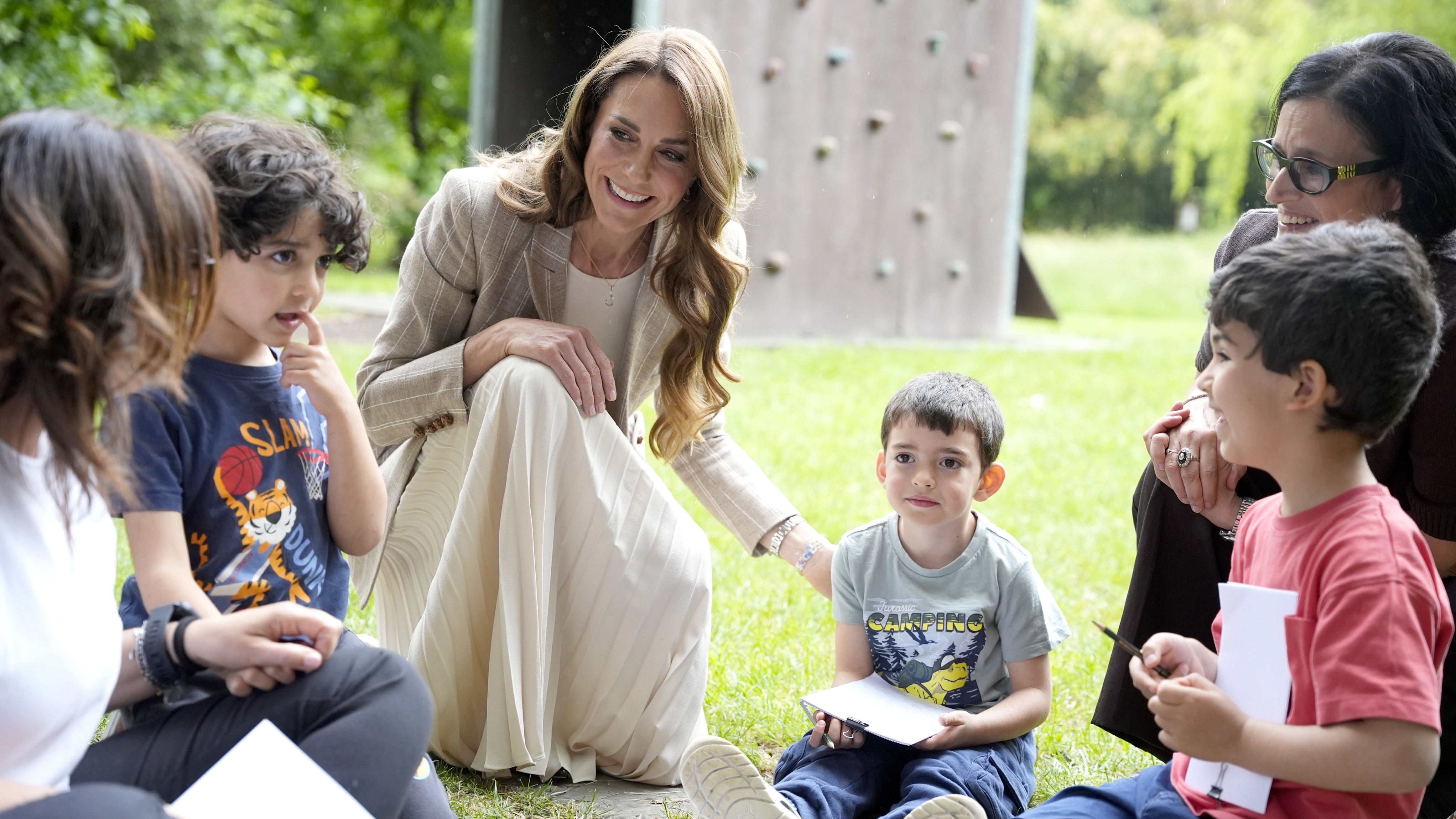 Catherine, Princess of Wales speaks to children as she visits the &amp;quot;Salvador Allende&amp;quot; Scuola dell'infanzia, to view education in nature