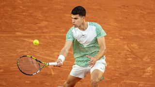 Carlos Alcaraz of Spain in action in the first round of the singles competition on Court Suzanne Lenglen during the 2023 French Open Tennis Tournament at Roland Garros