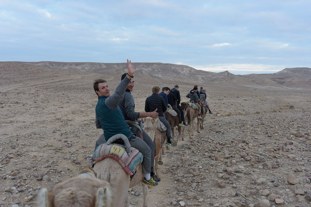 Mihkel Raim gets a camel ride during the Cycling Academy's team camp in Israel