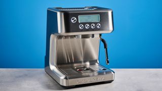 the casabrews ultra espresso machine with 20 bar pressure, a steam wand, LED screen, timer, and tamper accessories, photographed against a blue background