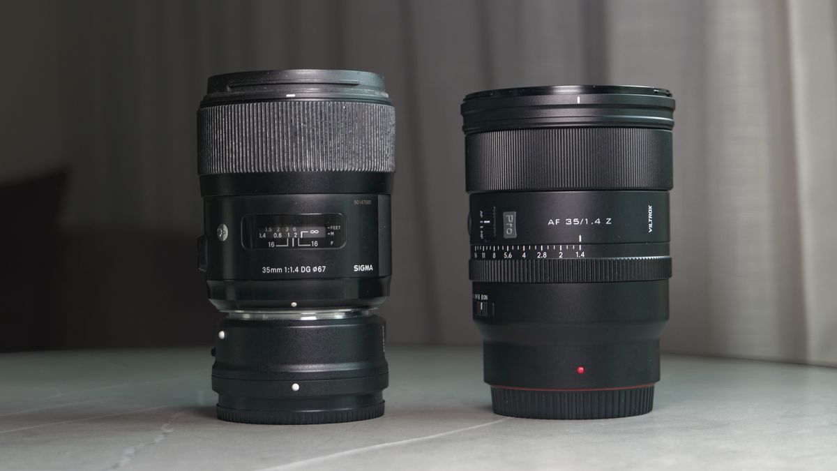 Viltrox AF 35mm F1.4 Pro lens alongside the Sigma 35mm f1/.4 DG Art lens with Nikon F to Z-mount adapter, on a white marble table