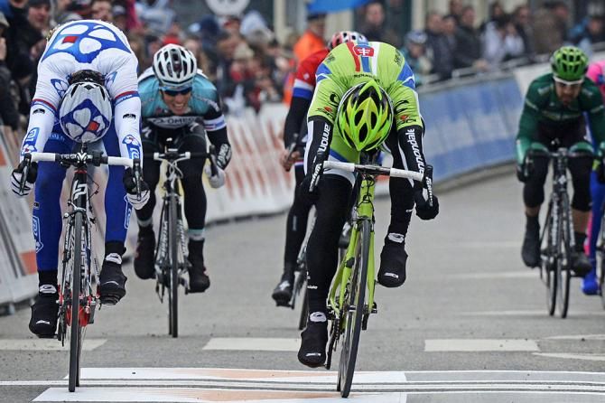 Both Peter Sagan (Cannondale) and Arnaud Demare (FdJ) throw their bikes
