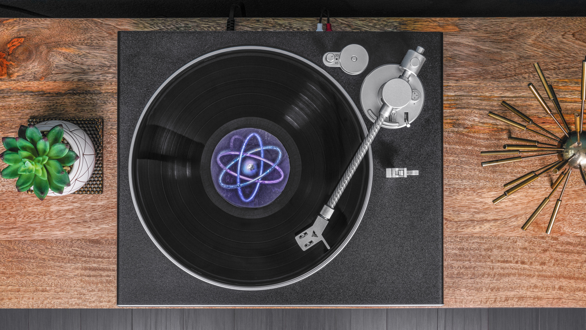 Victrola Hi-Res Carbon turntable from above, on a hi-fi stand, playing a vinyl record
