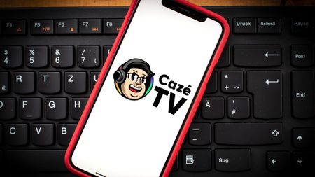iPhone with CazeTV logo superimposed onto the screen