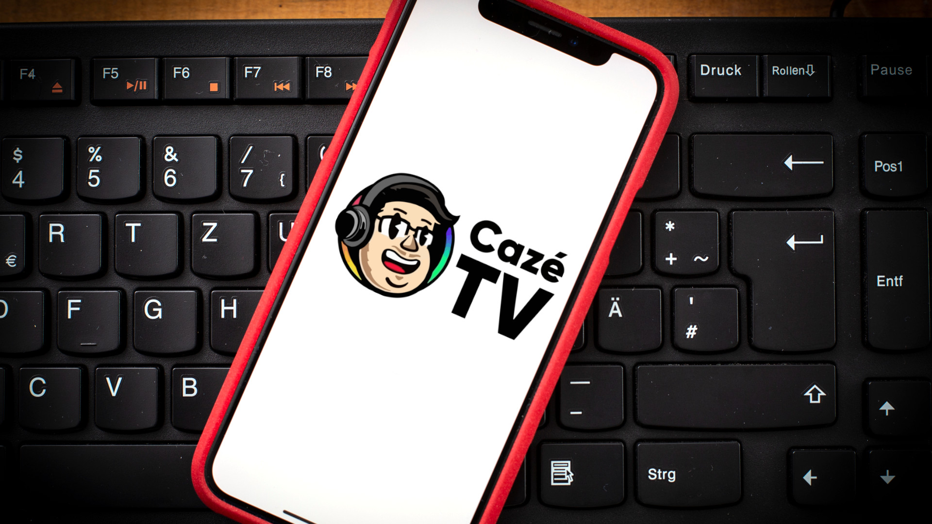 iPhone with CazeTV logo superimposed onto the screen
