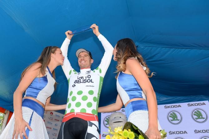 A green polka dotted Adam Hansen