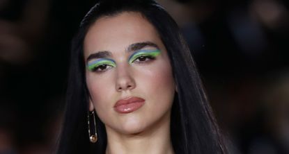  Dua Lipa walks the runway at the Versace fashion show during the Milan Fashion Week - Spring / Summer 2022 on September 24, 2021 in Milan, Italy.