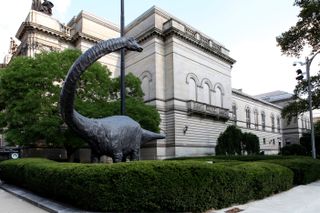 A giant dinosaur statue outside of the Carnegia Museum of Natural History in Pittsburgh, Pennsylvania
