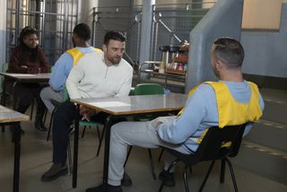 Adam visits Harvey in prison.
