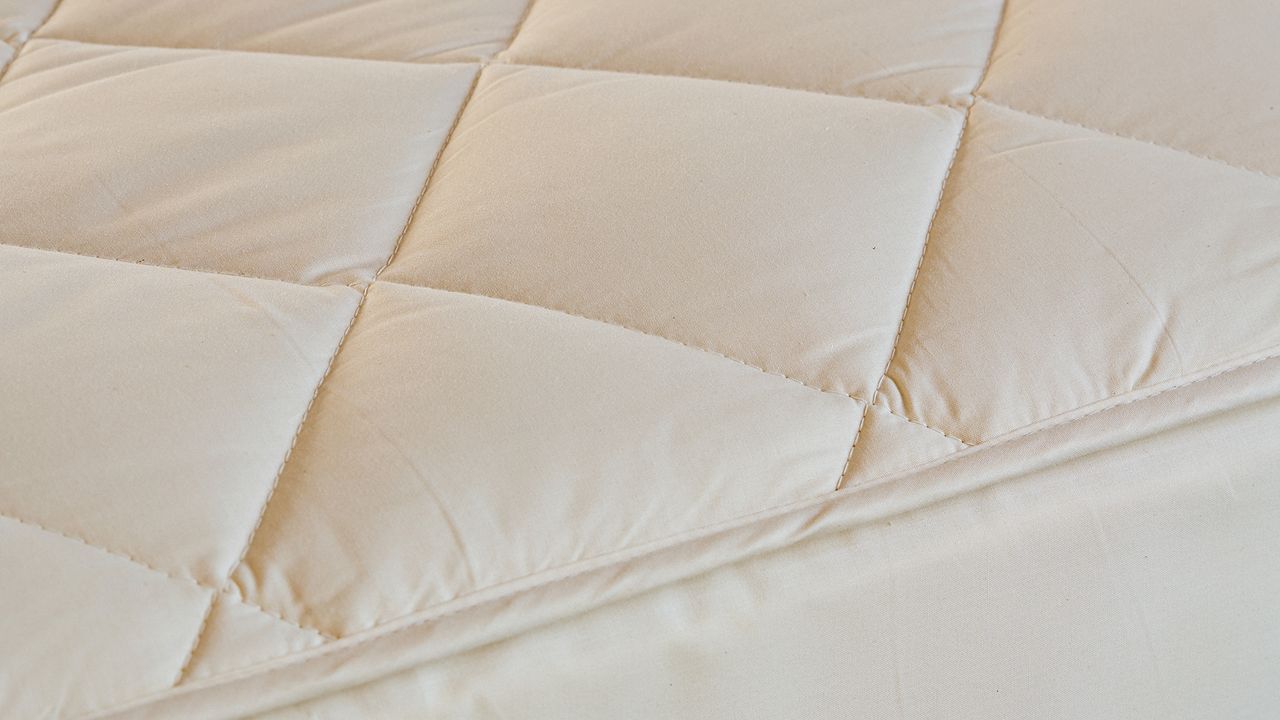 Close up of the quilted consistency of the Woolroom deluxe mattress protector