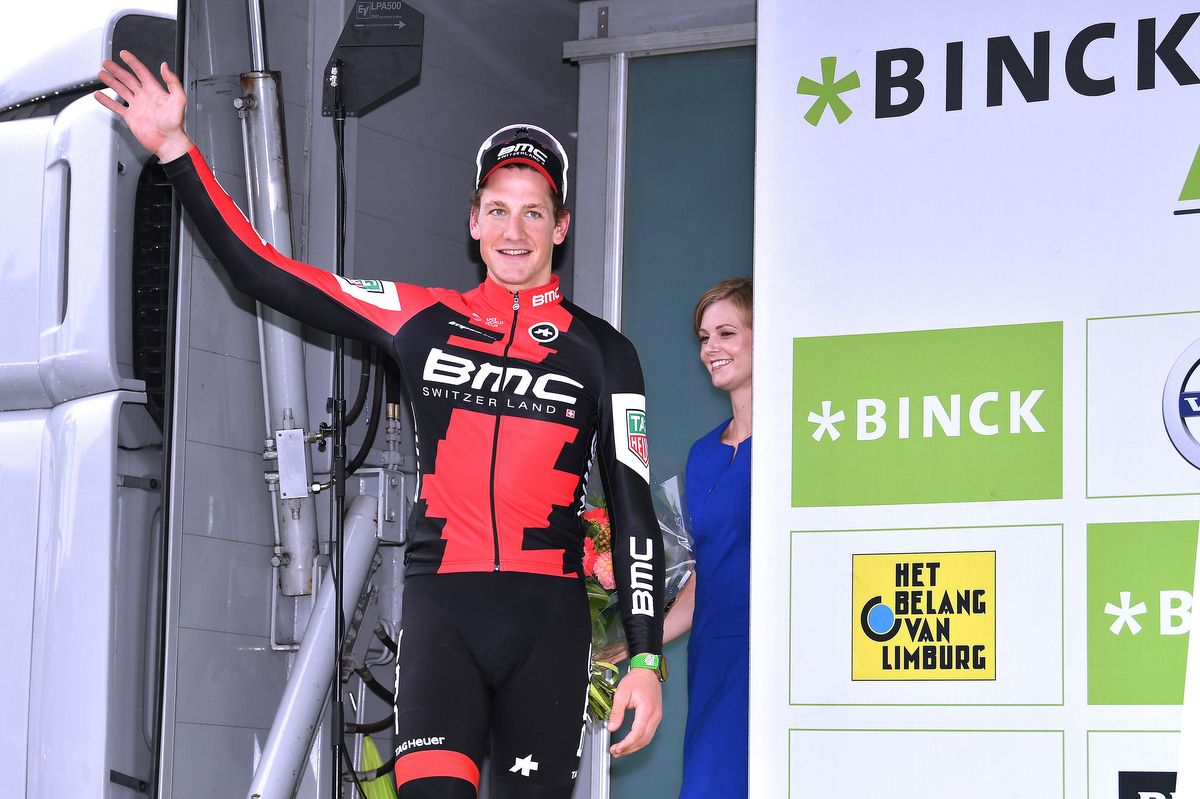 Stefan Kung (BMC) steps onto the podium to collect a third leader's jersey