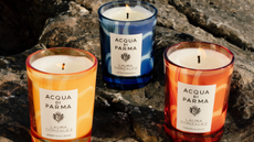 A blue, yellow, and orange candle from Acqua di Parma